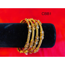 CBB1 - Gold bangles with uncut chocolate diamonds (size 2.4)