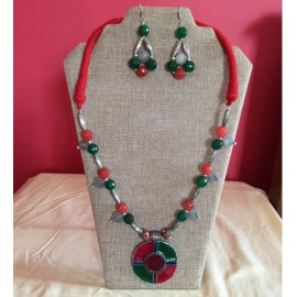 CBHJ64 Green and red beads with enamel pendant and red thread